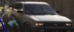 White sedan behind a fence in GTA 6