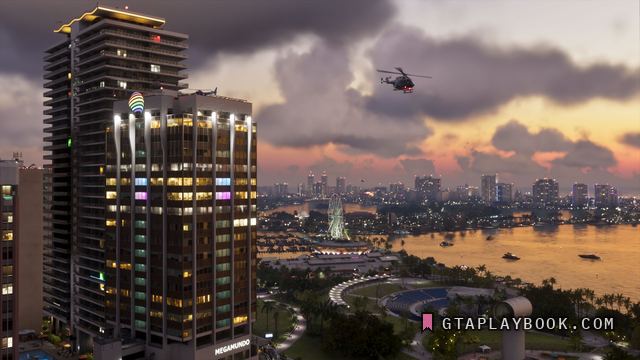 Vice City — Verlichte toren aan de baai bij zonsondergang met een
