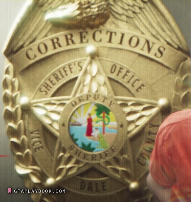 The corrections deputy's badge filling the frame at 1:04.57: CORRECTIONS over the top, SHERIFF'S OFFICE and DEPUTY around a state seal, VICE down the left point and COUNTY down the right, DALE on the banner at the foot