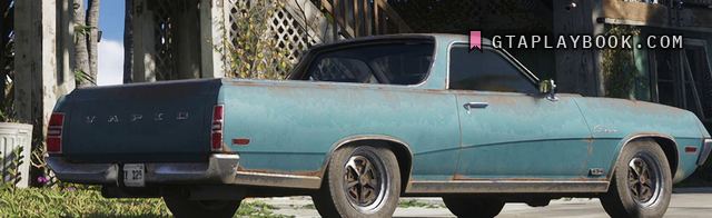 The Vapid Ganado on a driveway at 0:08.13: faded turquoise coupe utility, black roof, spaced chrome letters across the tailgate