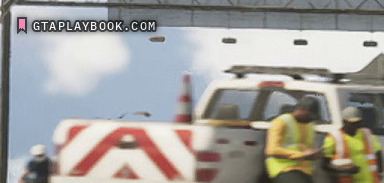 The maintenance truck at 0:34.60, in the verge with two crew in hi-vis and a chevron board behind it.